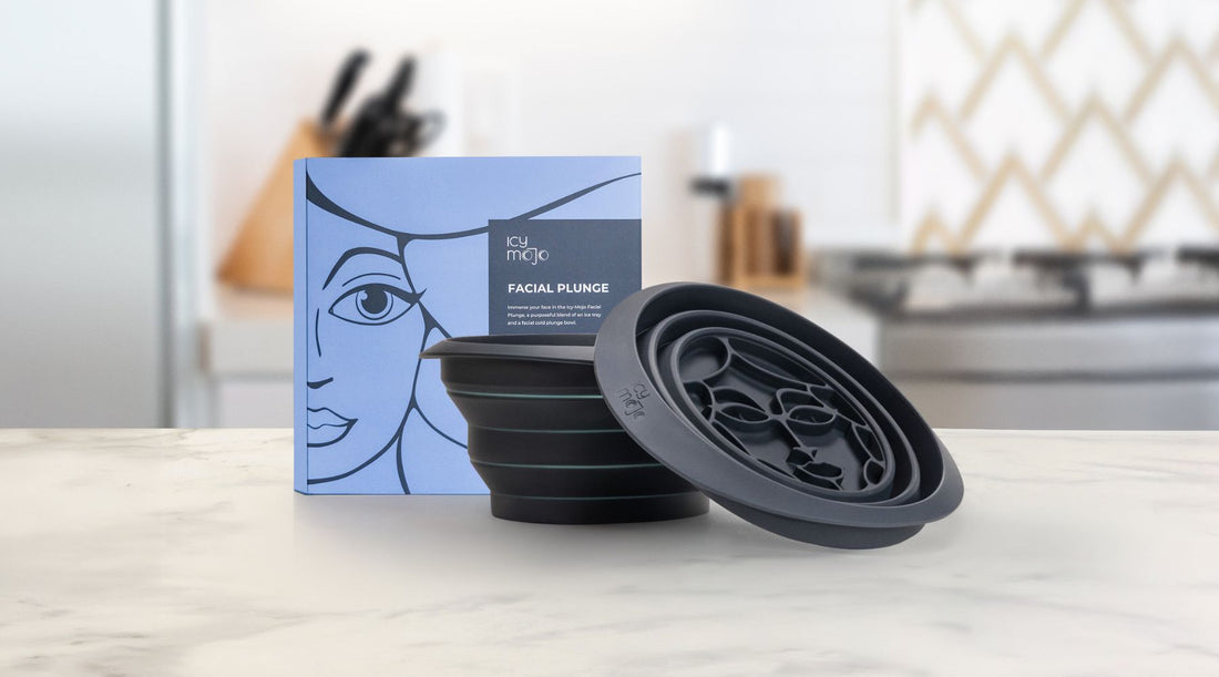 Icy Mojo Facial Cold Plunge product box with the collapsible silicone bowl displayed on a kitchen counter, showcasing the all-in-one ice facial tool designed for skin care and well-being.