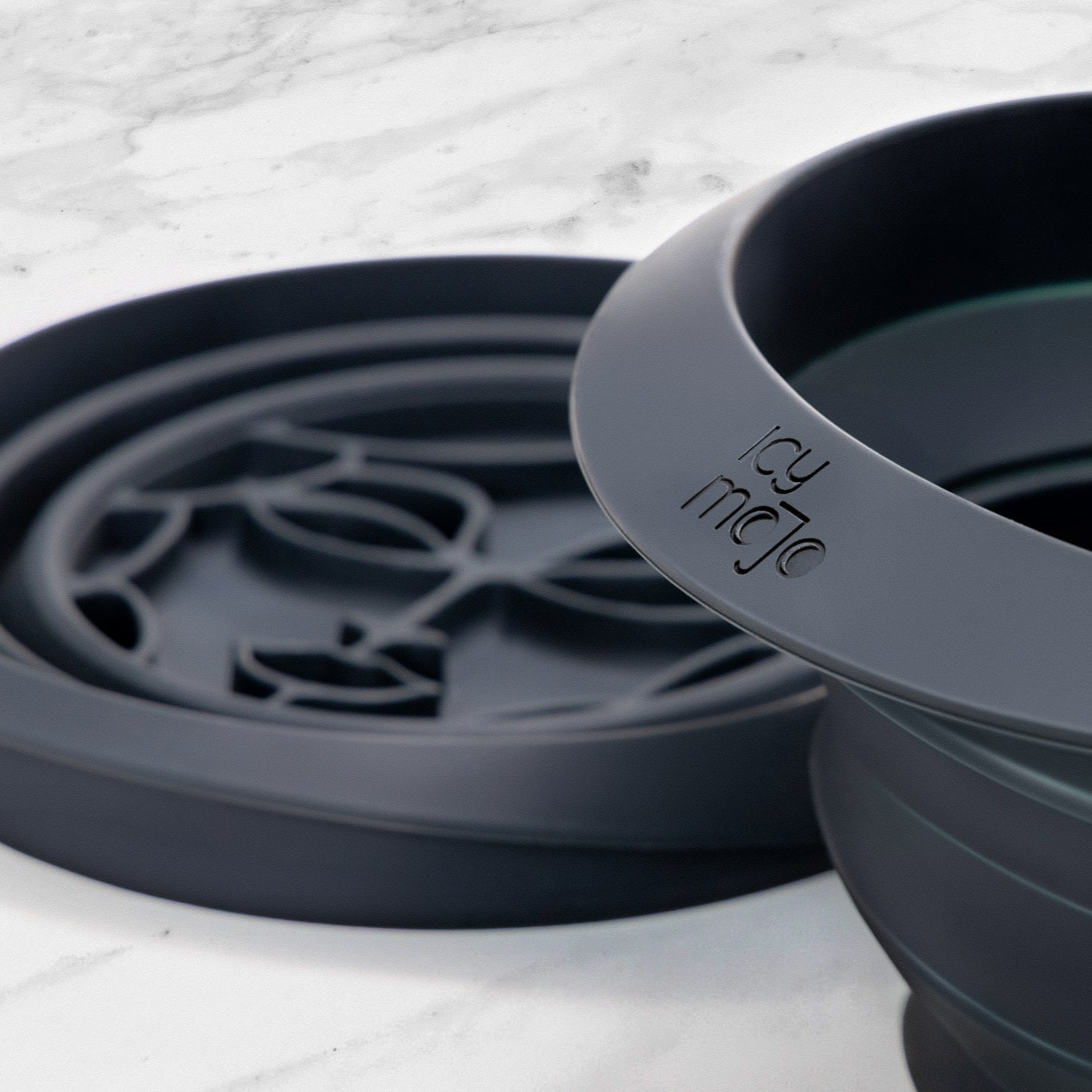 Close-up of Icy Mojo silicone facial ice bath, highlighting the product's design and logo.